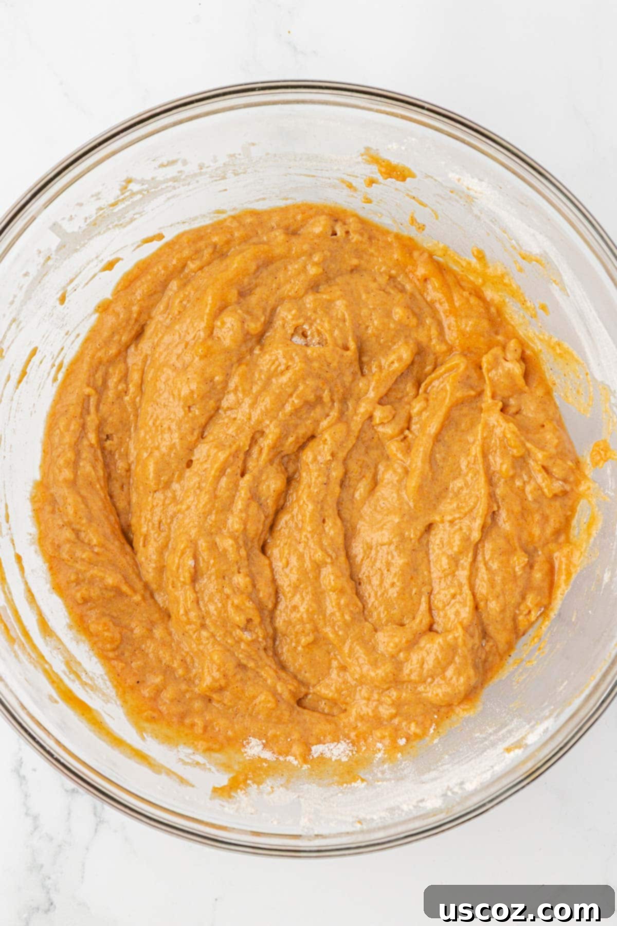 pumpkin donut mini muffin batter mixed, ready for baking