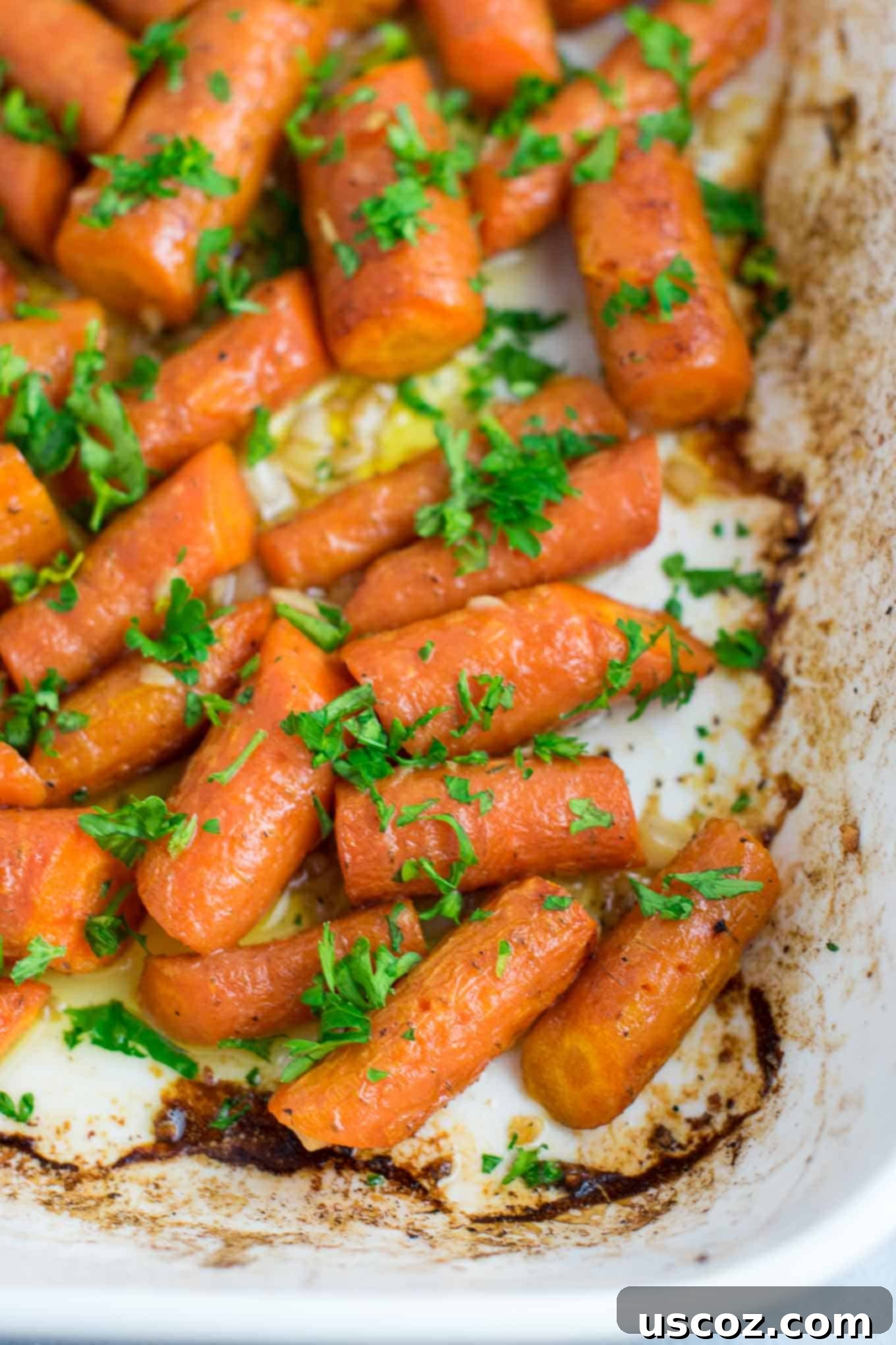 Mouthwatering Garlic Butter Roasted Carrots 2 Garlic butter roasted carrots recipe with fresh parsley. A delicious vegan friendly side dish recipe that will disappear in minutes! #vegan #roastedcarrots #garlicbutter #garlicbuttercarrots #sidedishes #vegetables