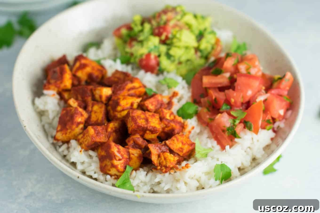 Effortless Enchilada Tofu Burrito Bowls 3 Easy enchilada tofu burrito bowls with homemade guacamole and salsa. Bring chipotle to your kitchen with this delicious recipe! #vegan #burritobowls #tofuburritobowls