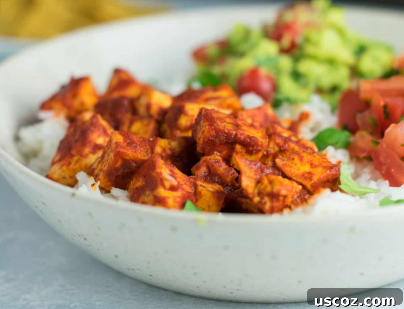 Effortless Enchilada Tofu Burrito Bowls 4 Easy enchilada tofu burrito bowls with homemade guacamole and salsa. Bring chipotle to your kitchen with this delicious recipe! #vegan #burritobowls #tofuburritobowls