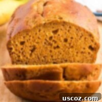 Wholesome Spiced Pumpkin and Banana Bread 13 Healthy pumpkin banana bread being cut into slices