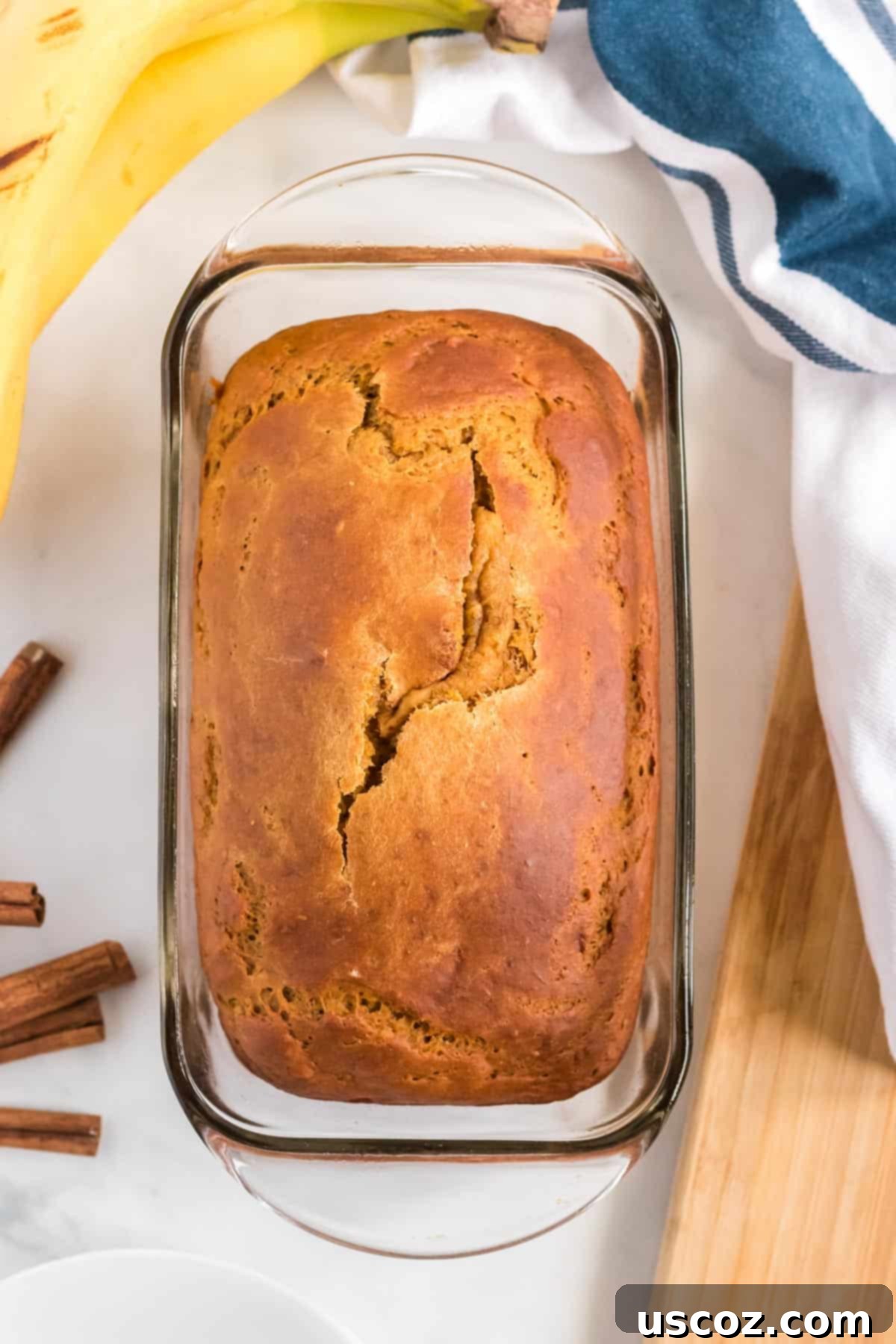 Wholesome Spiced Pumpkin and Banana Bread 6 Freshly baked pumpkin banana bread still in the loaf pan, golden and fragrant.