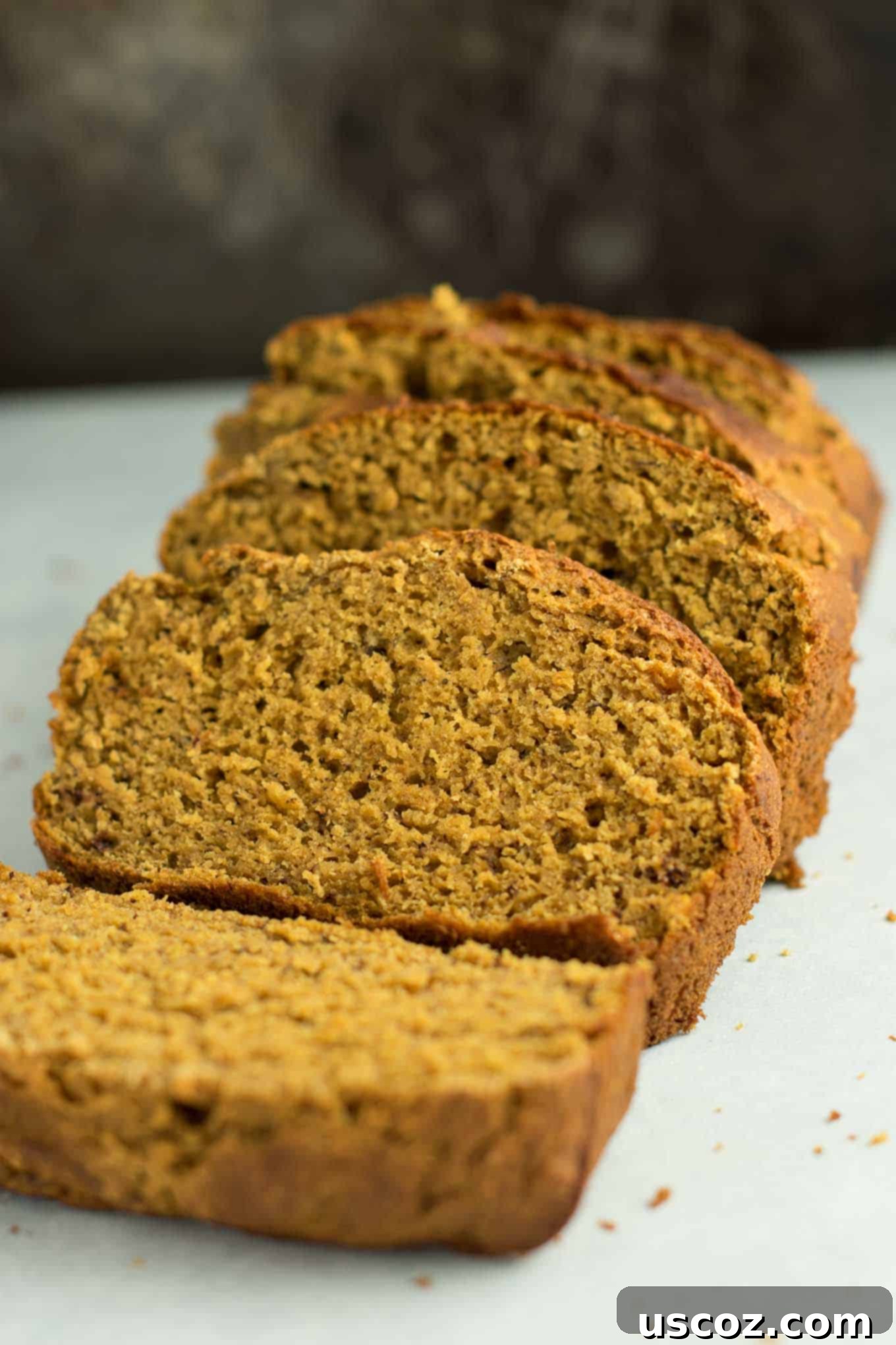 Wholesome Spiced Pumpkin and Banana Bread 8 Close-up of a slice of pumpkin banana bread, revealing its tender, moist interior and delicious texture.
