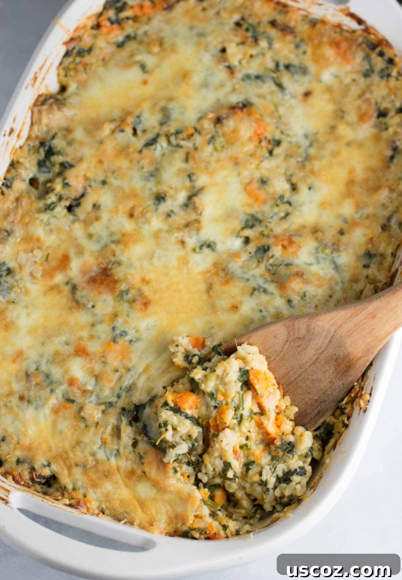 Sweet Potato Brown Rice Casserole made with greek yogurt, mushrooms, spinach, mozzarella, parmesan, and cheddar cheese - a hearty vegetarian comfort food recipe. No cream of anything soup! #casserole #vegetarian #sweetpotatobrownricecasserole #brownrice