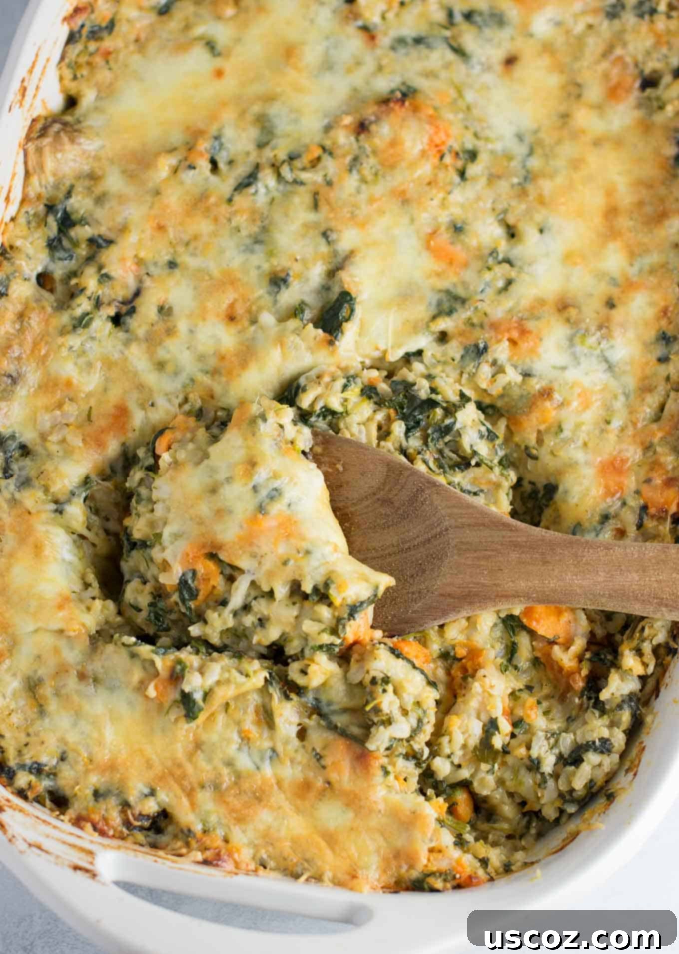 Sweet Potato Brown Rice Casserole made with greek yogurt, mushrooms, spinach, mozzarella, parmesan, and cheddar cheese - a hearty vegetarian comfort food recipe. No cream of anything soup! #casserole #vegetarian #sweetpotatobrownricecasserole #brownrice