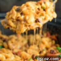 Simmered Plant-Based Chili Mac 15 This Slow Cooker Vegetarian Chili Mac Recipe is made all in the crockpot (even the noodles!). A super easy vegetarian crockpot recipe to feed a crowd. #vegetarian #slowcooker #crockpot #chilimac