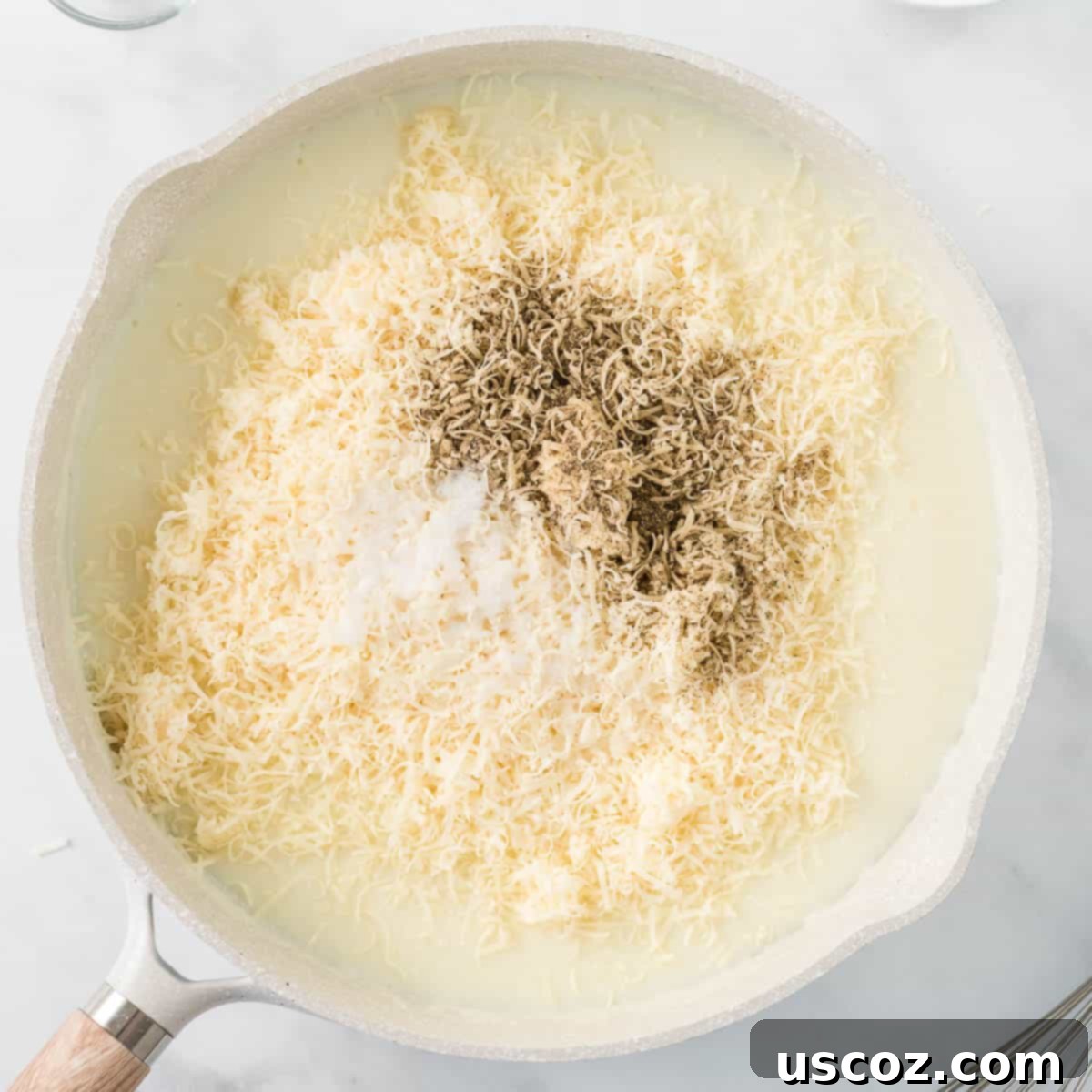 Creamy Cauliflower Alfredo 11 adding the cheese, salt, and pepper to the alfredo sauce
