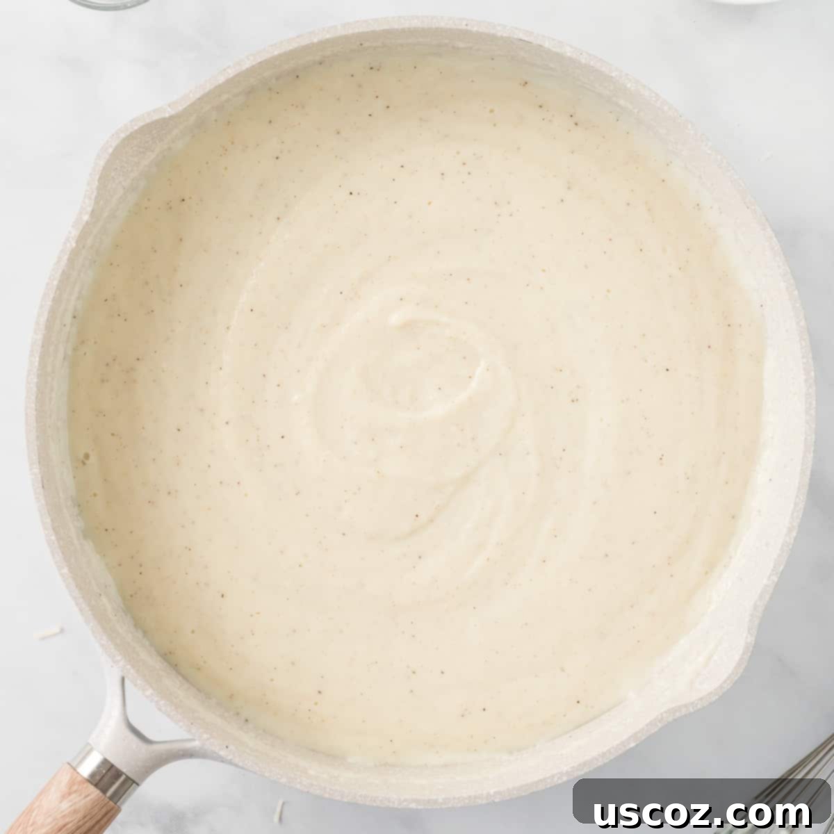 Creamy Cauliflower Alfredo 12 cauliflower Alfredo sauce in a skillet