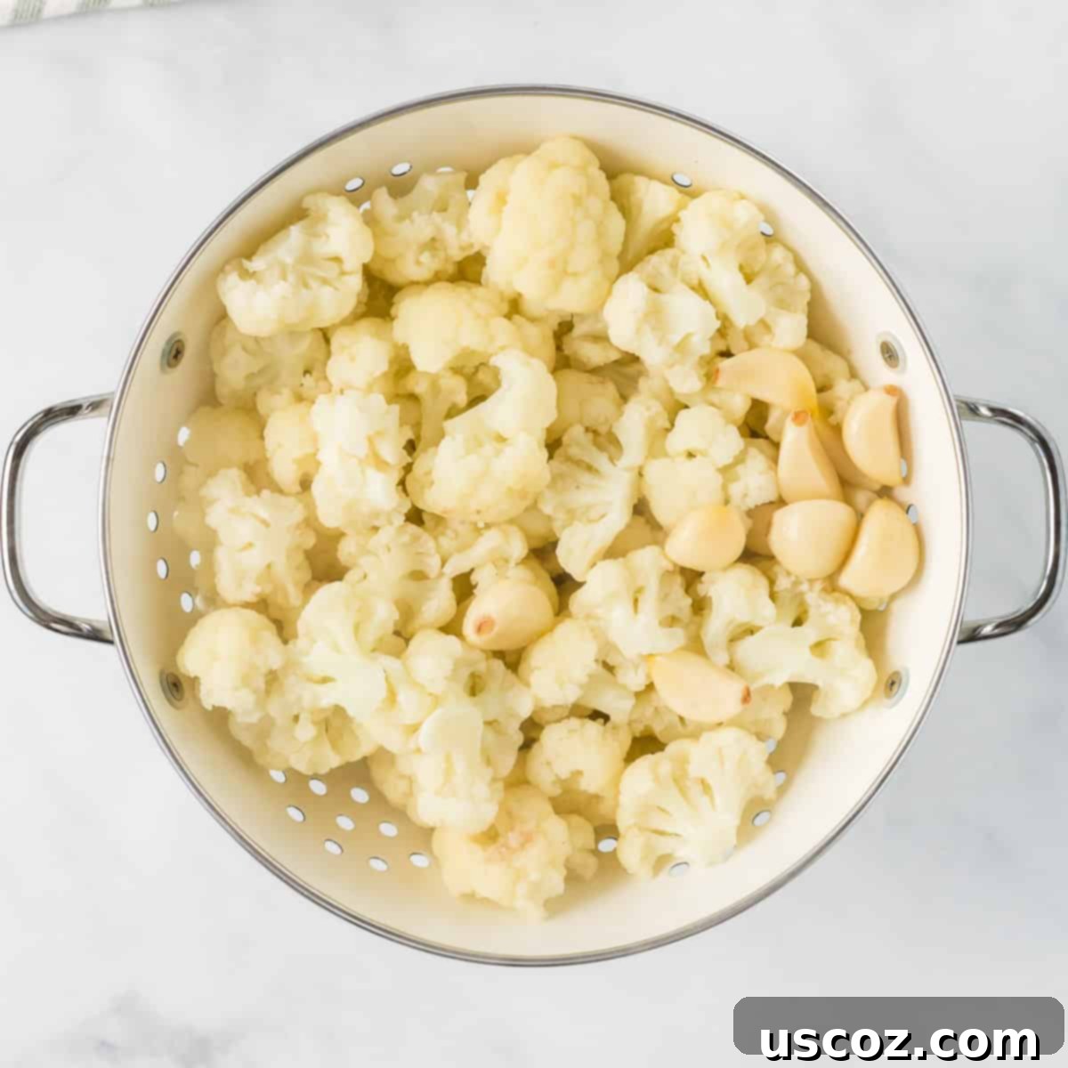 Creamy Cauliflower Alfredo 5 steamed cauliflower and garlic in a strainer