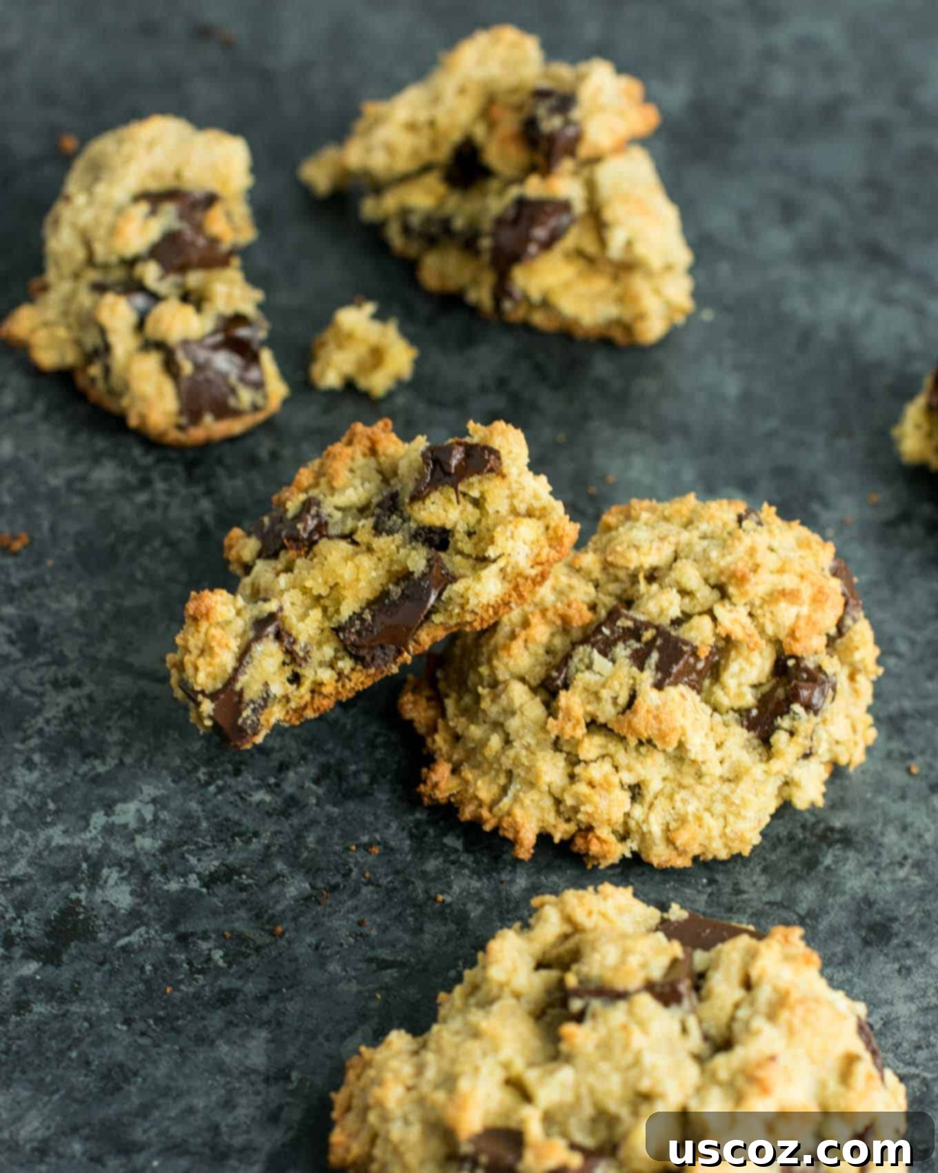 A plate of Gluten-Free Oatmeal Chocolate Chip Cookies with a glass of milk, ready for enjoyment.