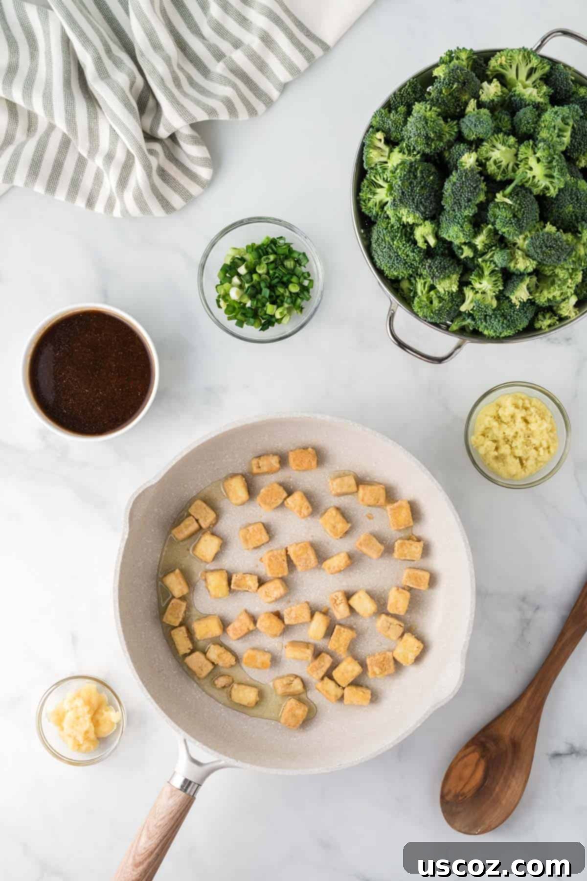 Flavorful Tofu and Broccoli Stir-Fry 9 cooked tofu in the skillet surrounded by the recipe ingredients