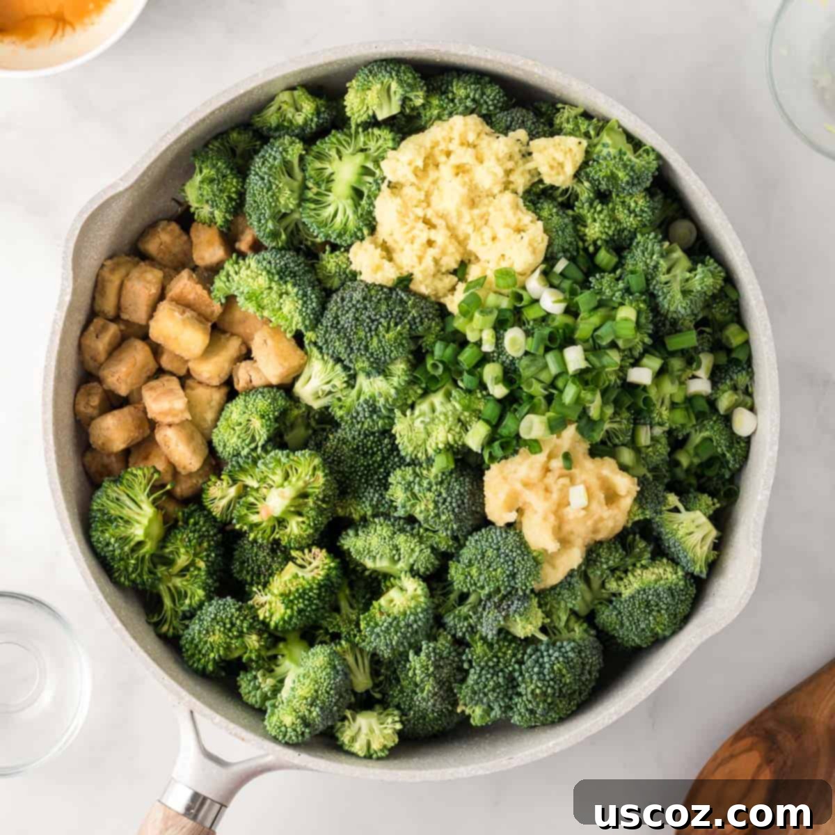 Flavorful Tofu and Broccoli Stir-Fry 10 adding the broccoli, garlic, ginger, green onions, and stir fry sauce to the tofu