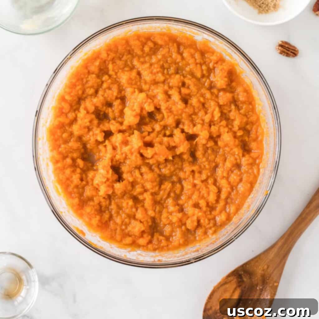 Ultimate Gluten Free Sweet Potato Casserole 10 ingredients for the sweet potatoes in a bowl mixed together