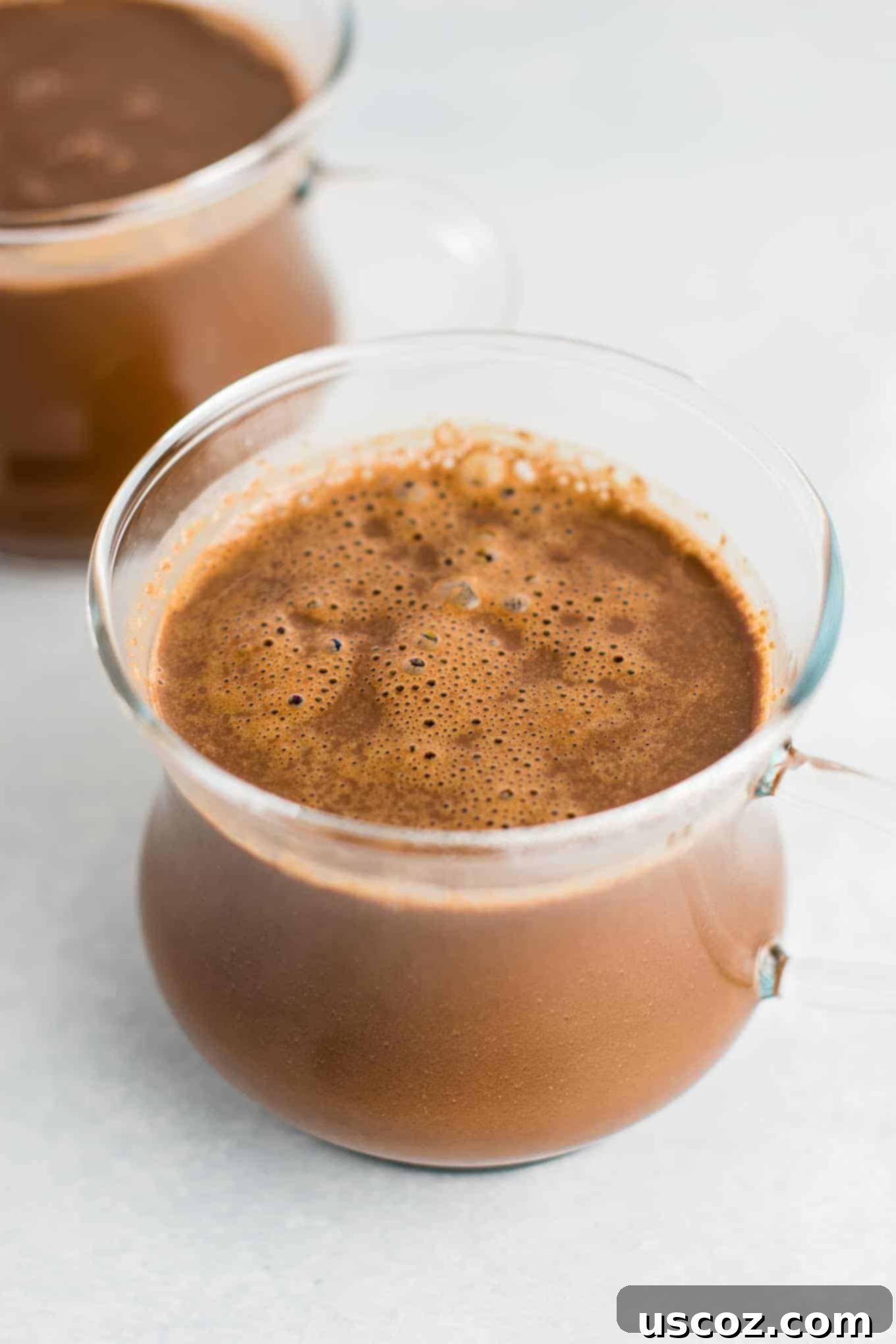 Creamy Vegan Hot Chocolate 2 Easy 4-Ingredient vegan hot chocolate recipe made with almond milk. Dairy-free, gluten-free, and vegan. The perfect cozy winter drink! #vegan #hotchocolate #drinks #christmas #dairyfree