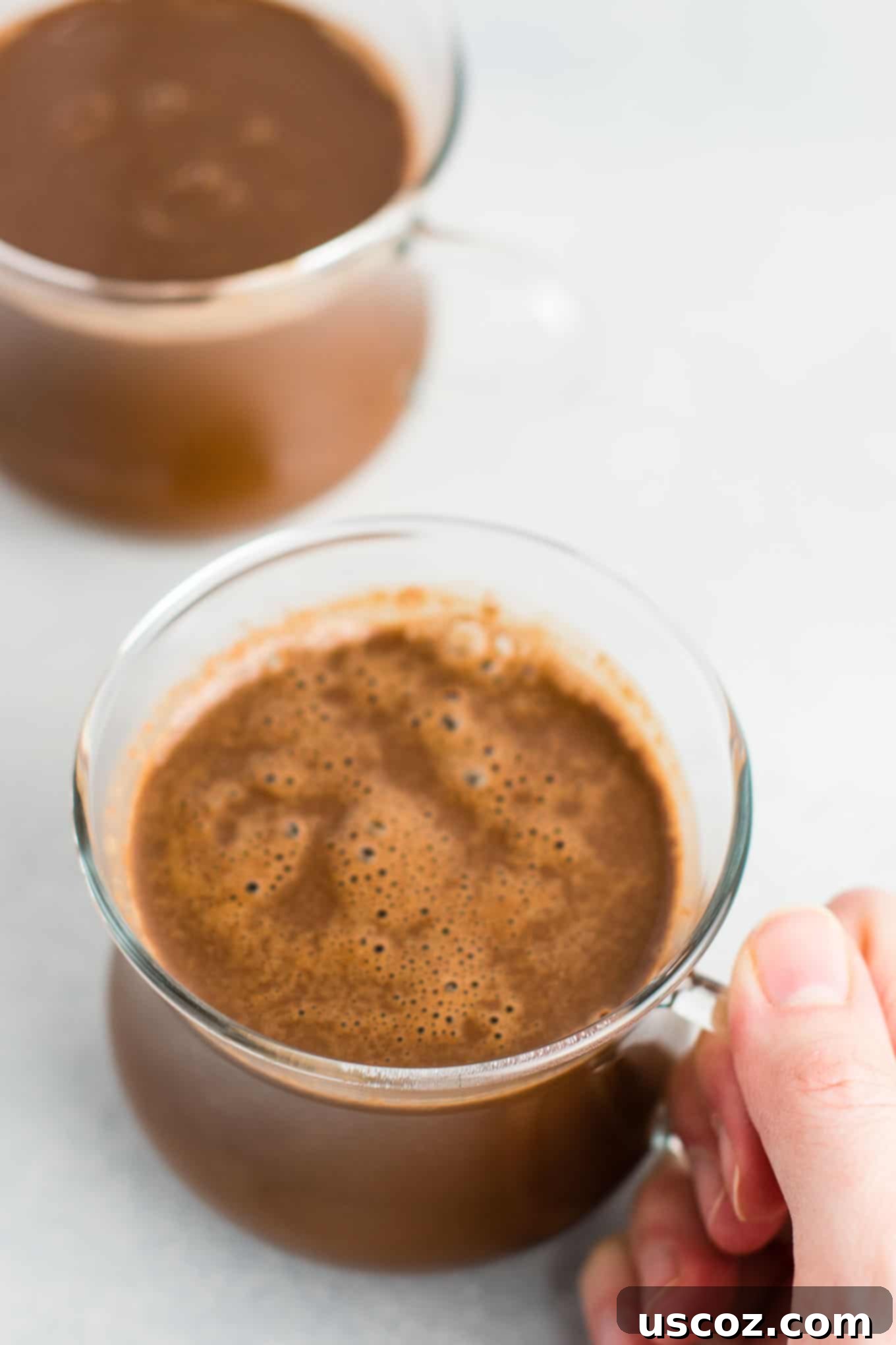 Creamy Vegan Hot Chocolate 3 Easy 4-Ingredient vegan hot chocolate recipe made with almond milk. Dairy-free, gluten-free, and vegan. The perfect cozy winter drink! #vegan #hotchocolate #drinks #christmas #dairyfree