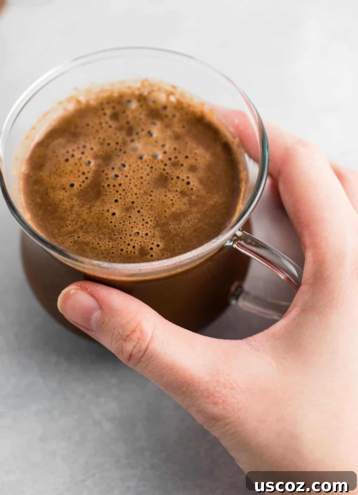 Creamy Vegan Hot Chocolate 5 Easy 4-Ingredient vegan hot chocolate recipe made with almond milk. Dairy-free, gluten-free, and vegan. The perfect cozy winter drink! #vegan #hotchocolate #drinks #christmas #dairyfree