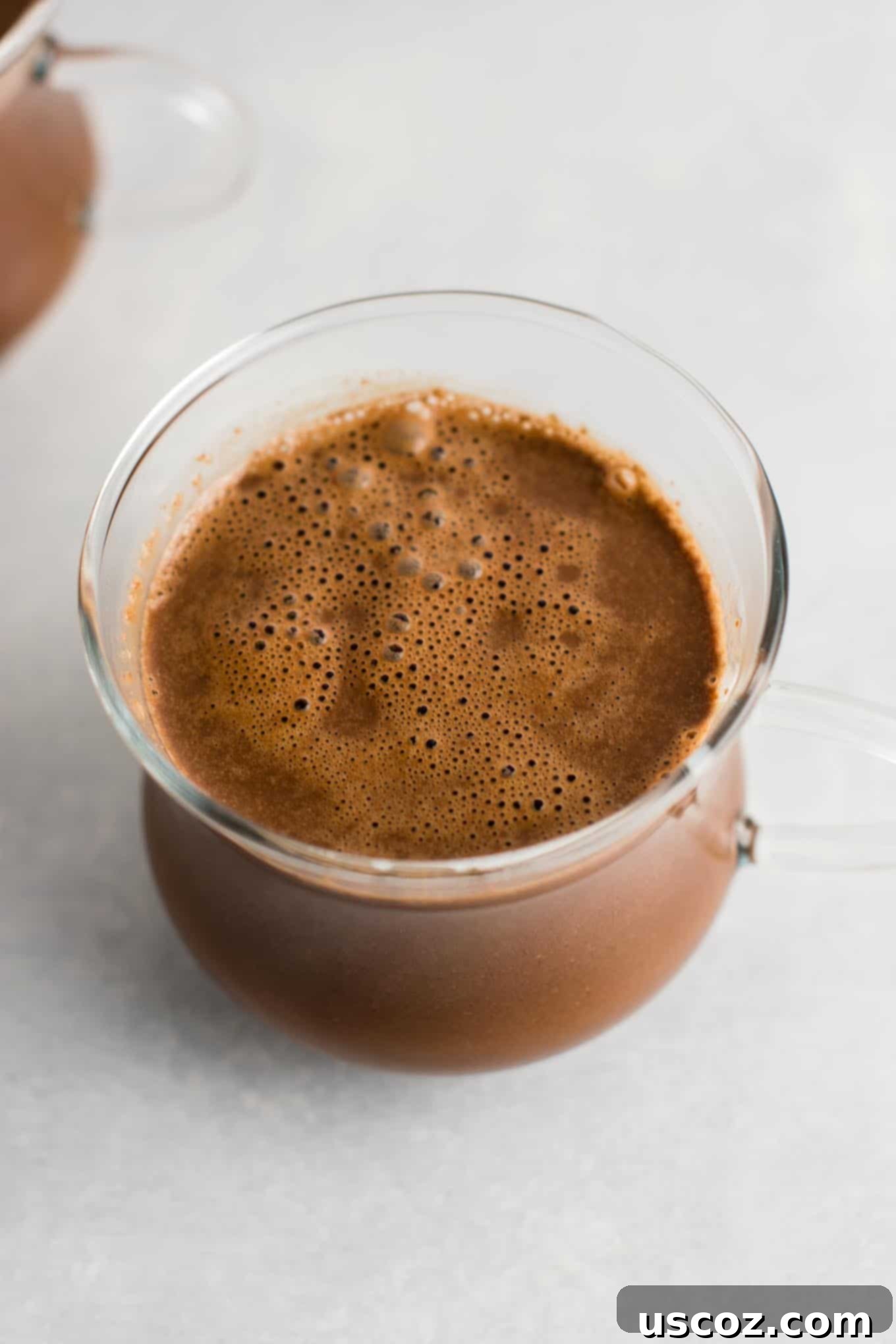 Creamy Vegan Hot Chocolate 6 Easy 4-Ingredient vegan hot chocolate recipe made with almond milk. Dairy-free, gluten-free, and vegan. The perfect cozy winter drink! #vegan #hotchocolate #drinks #christmas #dairyfree