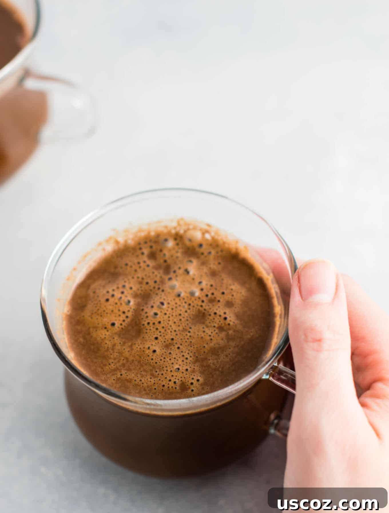 Creamy Vegan Hot Chocolate 7 Easy 4-Ingredient vegan hot chocolate recipe made with almond milk. Dairy-free, gluten-free, and vegan. The perfect cozy winter drink! #vegan #hotchocolate #drinks #christmas #dairyfree
