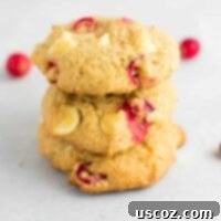 Delightful Cranberry White Chocolate Chip Cookies 10 cranberry white chocolate cookies stacked on top of each other