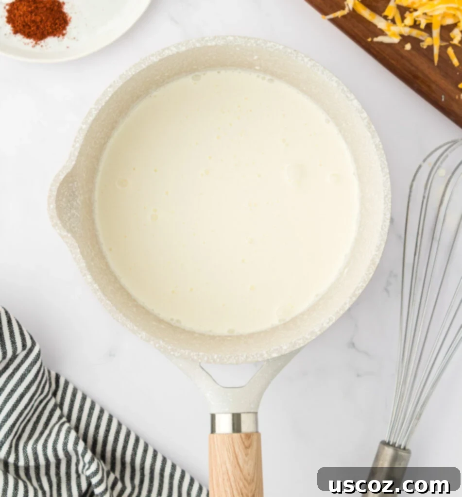 Cheesy Nacho Dip in Minutes 5 heavy cream in a sauce pan