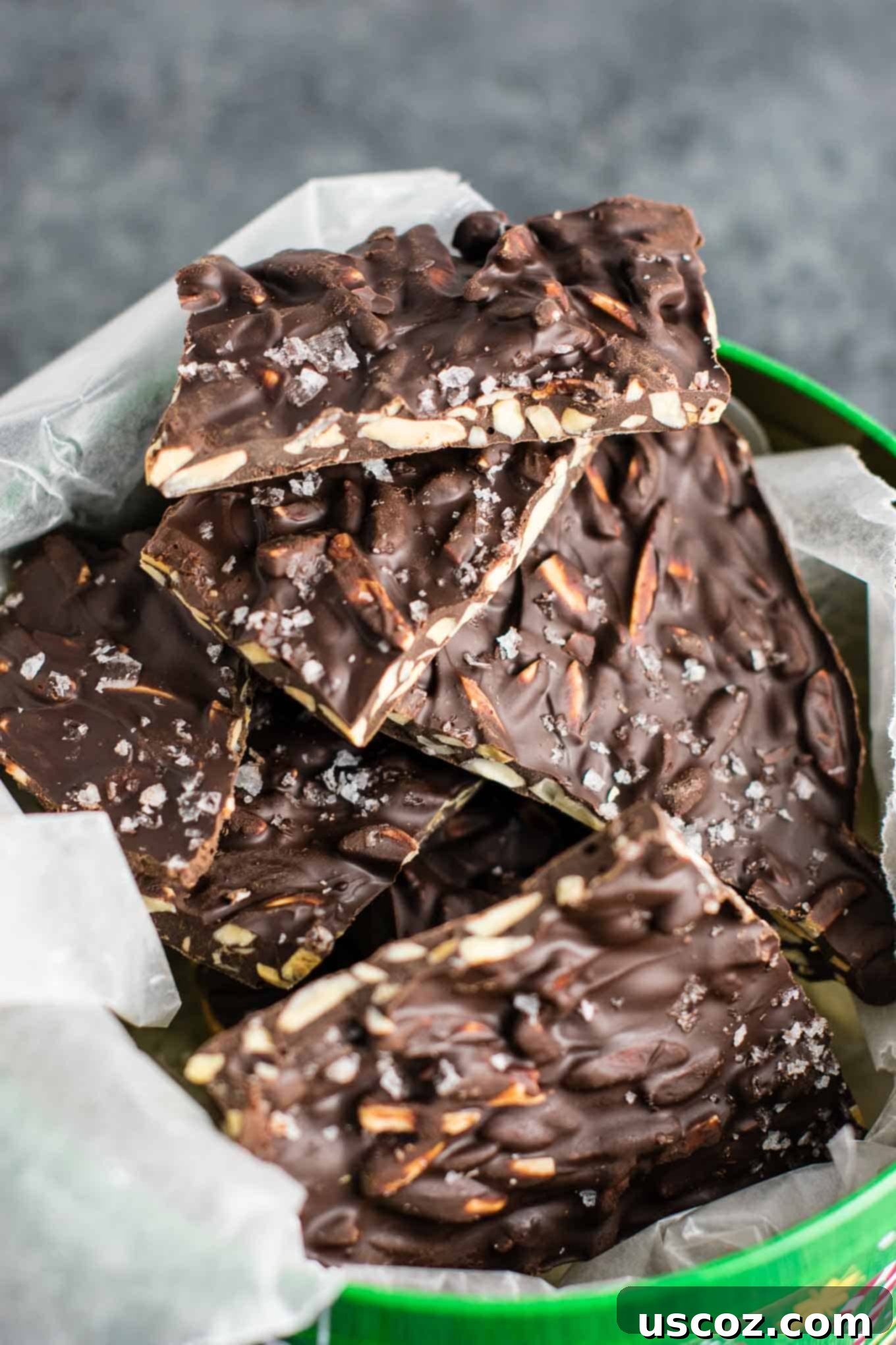 Decadent Dark Chocolate Almond Bark 8 An array of dark chocolate almond bark pieces, artfully arranged and showcasing their irresistible appeal for a holiday gathering.
