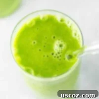 Vibrant Citrus Kale Green Smoothie 11 green smoothie in a glass with a straw