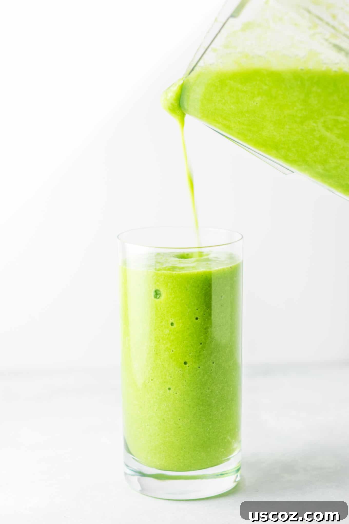 Vibrant Citrus Kale Green Smoothie 7 a glass filled with smoothie