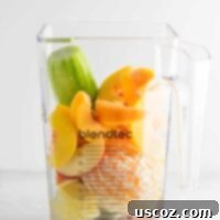 Ginger peach detox smoothie recipe with fresh cucumber and lemon. Packed full of healthy ingredients, naturally vegan, and so refreshing! #healthysmoothie #detoxsmoothie #gingerpeachsmoothie #vegan #smoothierecipes