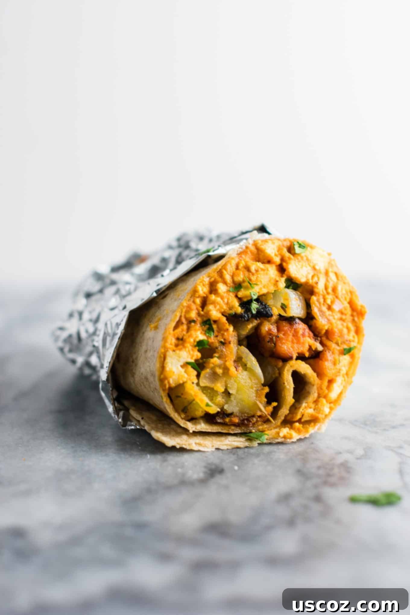 Plant-Based Breakfast Burrito Bliss 12 An overhead shot of a delightful breakfast spread, including a vegan burrito.