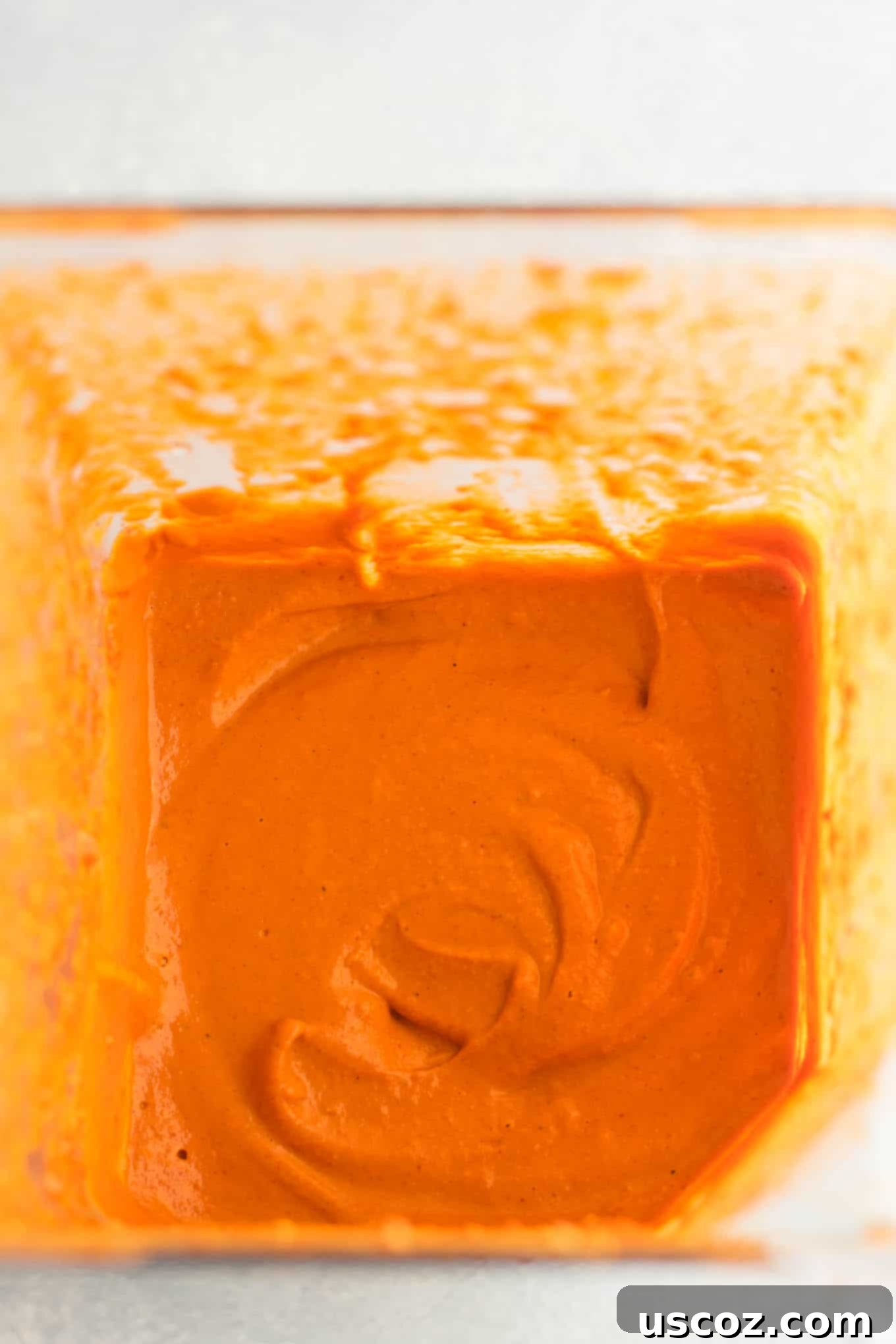 Plant-Based Breakfast Burrito Bliss 5 Smooth and creamy cashew enchilada sauce in a blender cup.