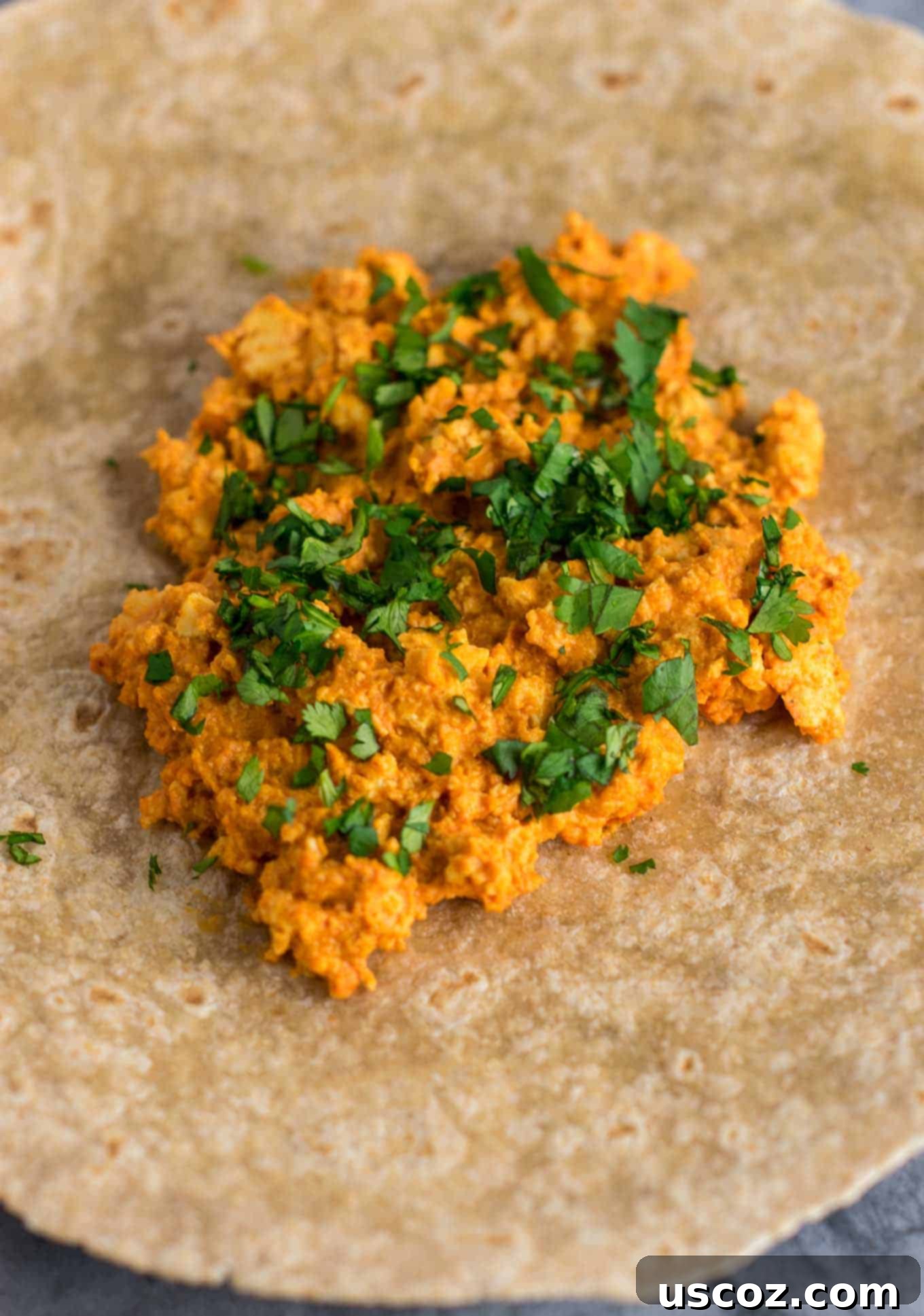 Plant-Based Breakfast Burrito Bliss 6 Crumbled extra-firm tofu being cooked in a skillet for a vegan scramble.