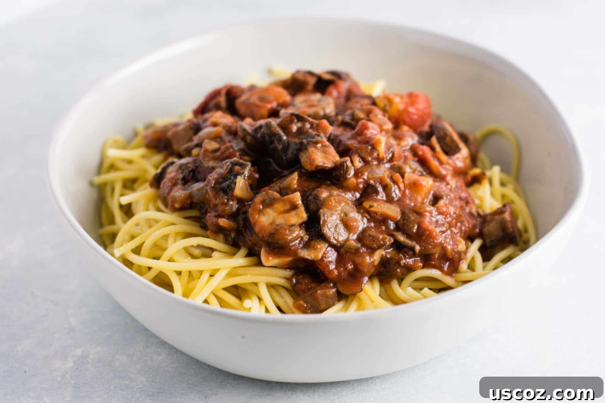 Delicious Vegetarian Spaghetti Sauce 15 meatless spaghetti sauce over pasta in a white bowl