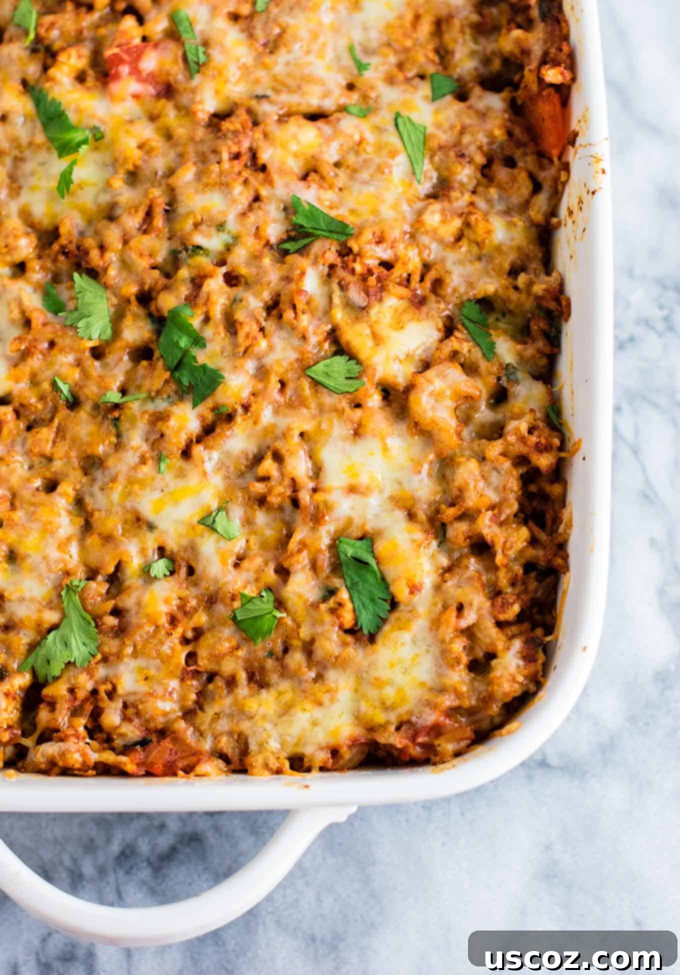 Spicy Mexican Tofu Rice Bake 7 Scrambled extra-firm tofu cooking in a skillet, showing its crumbly texture and browned edges.