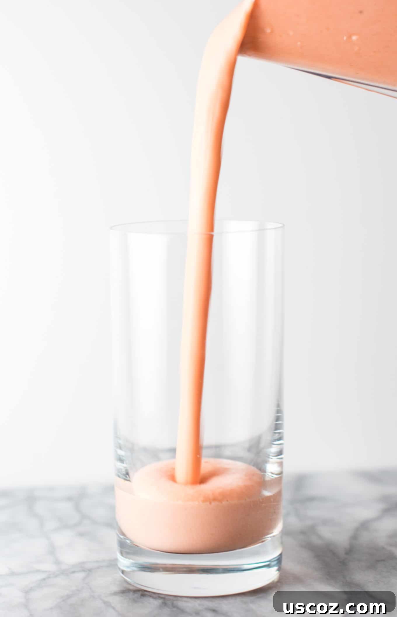 Carrot Cake Dream 3 smoothie being poured into a glass