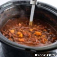 Easy Slow Cooker Vegetarian Sweet Potato Chili 14 Slow Cooker Vegetarian Sweet Potato Chili in a bowl with toppings.