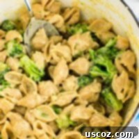 The Ultimate Broccoli Mac and Cheese 10 Lightened up broccoli shells and cheese with sharp cheddar cheese and whole wheat pasta. The healthiest way to justify eating macaroni and cheese for dinner. Kids will love this one! #broccolishellsandcheese #macandcheese #healthy #dinner #vegetarian #meatless #pasta #wholewheat