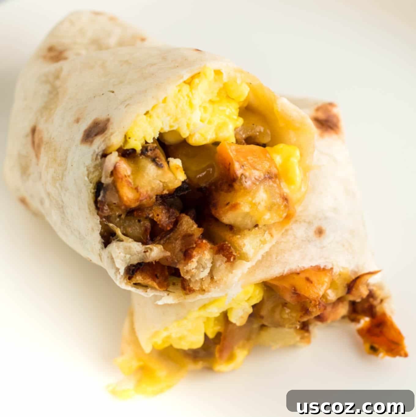 Your New Favorite Breakfast Burrito 5 A perfectly assembled breakfast burrito, cut in half to show its delicious layers