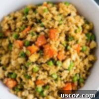 Wholesome Cauliflower Tofu Fried Rice 13 Close-up of a serving of Cauliflower Tofu Fried Rice, a vegan, gluten-free, and grain-free dish.
