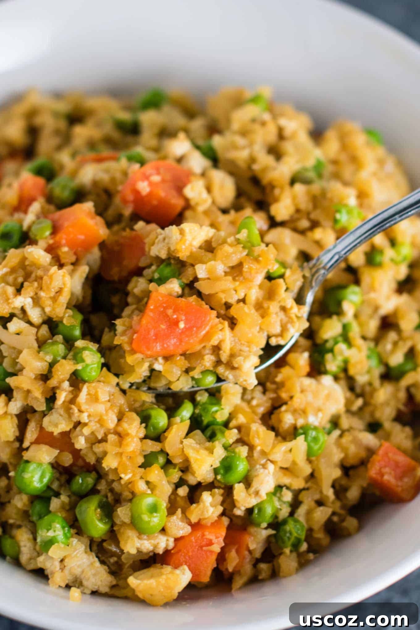 Wholesome Cauliflower Tofu Fried Rice 5 Crumbled extra-firm tofu being sautéed in a skillet, preparing the egg-free 'scrambled egg' component for the vegan fried rice.
