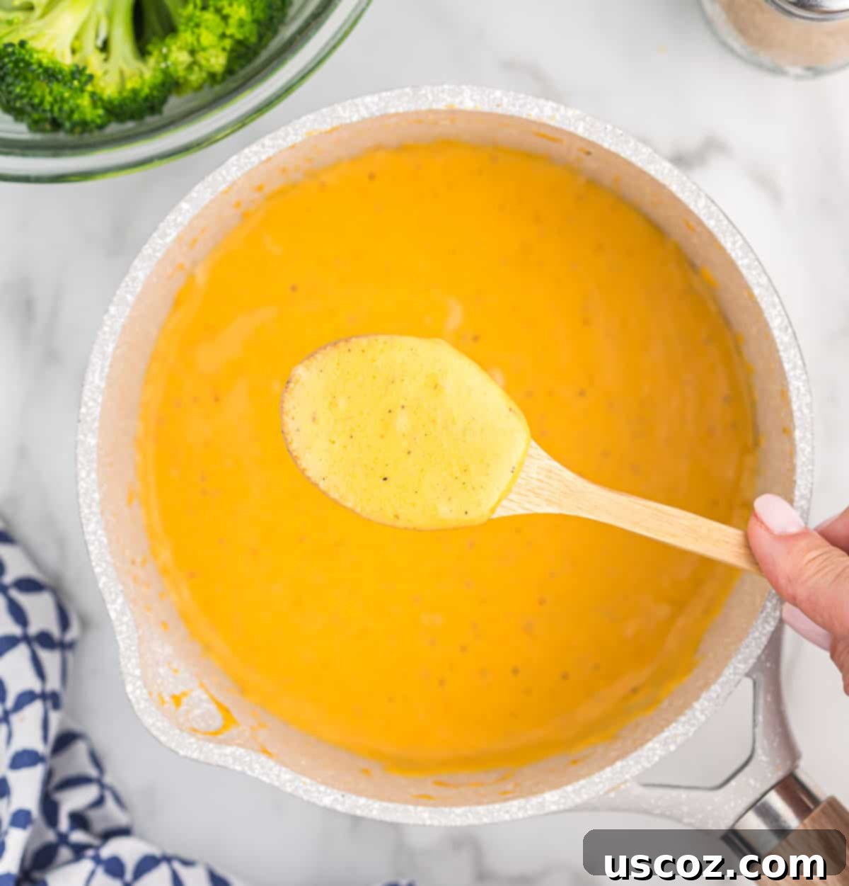 Ultimate Cheesy Broccoli Sauce 8 Creamy cheddar cheese sauce in a saucepan, showing its smooth, rich texture