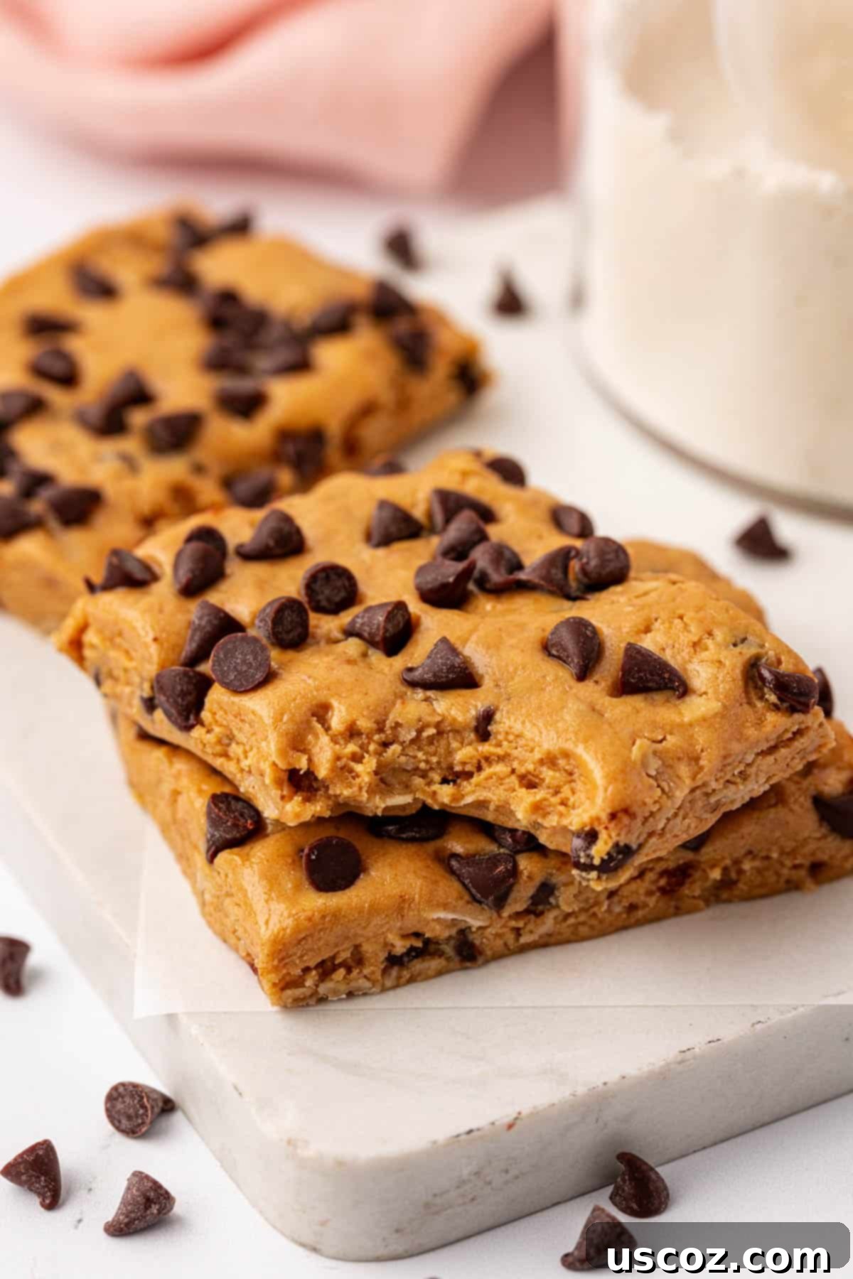 PB & Chocolate Chip Protein Bars 12 A stack of two finished peanut butter chocolate chip protein bars.