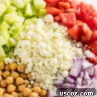 Tangy Greek Cucumber Delight 10 Cucumber chickpea greek salad with lemon olive oil dressing. I made this for meal prep lunches and it was amazing! #mealprep #vegetarian #salad #greeksalad #cucumbergreeksalad #chickpeagreeksalad #meatless #vegetariansalad