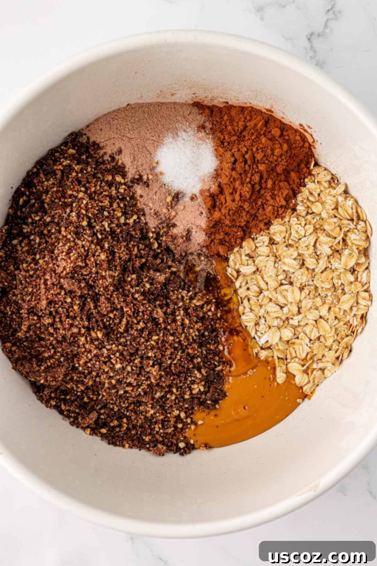 Chocolate Cashew Protein Bars 7 protein bar ingredients in a mixing bowl