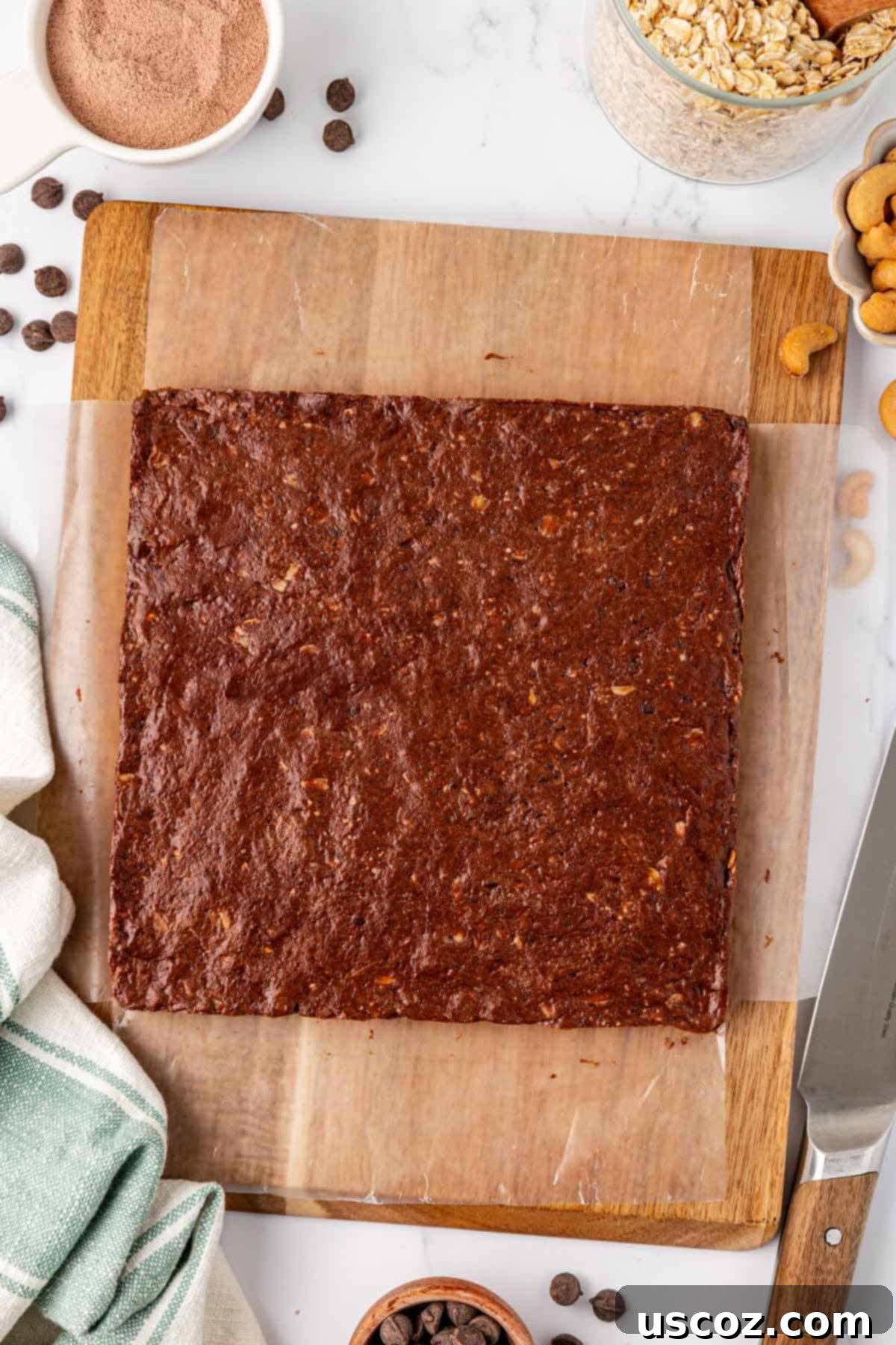 Chocolate Cashew Protein Bars 10 chocolate cashew protein bar batter on a cutting board