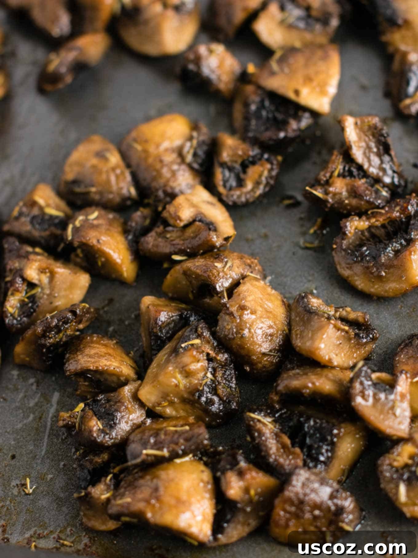No-Fuss Roasted Mushrooms 3 Close-up of roasted mushrooms glistening with olive oil and spices.