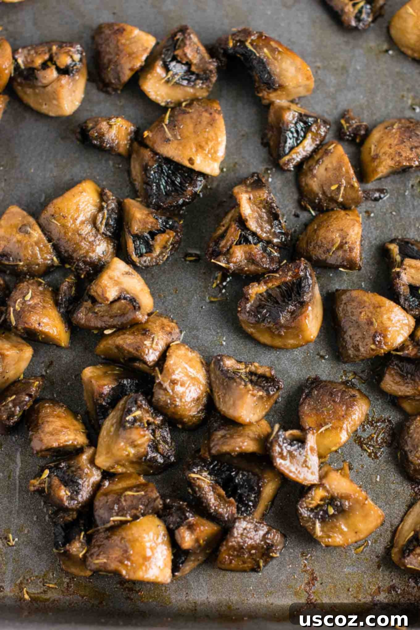 No-Fuss Roasted Mushrooms 6 A bowl of roasted mushrooms with a fork, ready to be enjoyed.