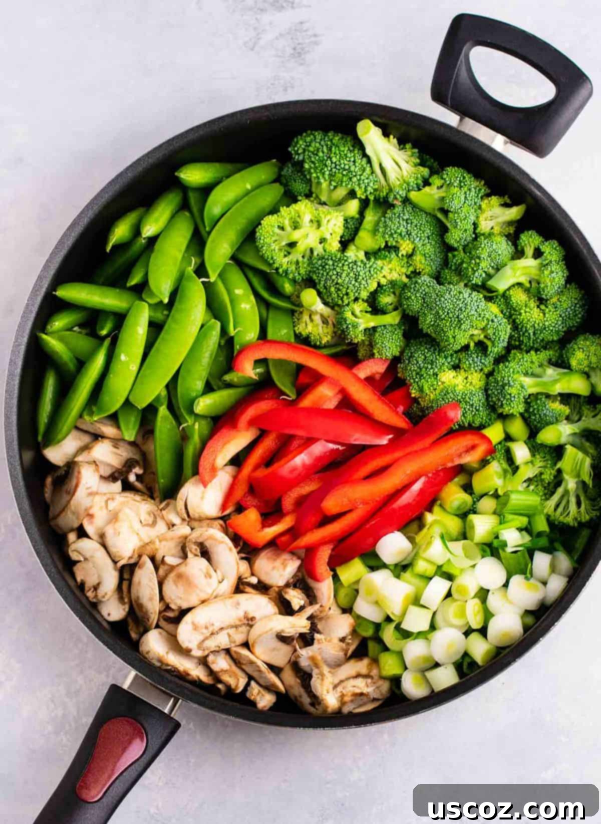 Stir Fry Stars: Essential Veggies 3 a skillet with stir fry veggies - snap peas, broccoli, red bell pepper, green onion, and sliced mushrooms