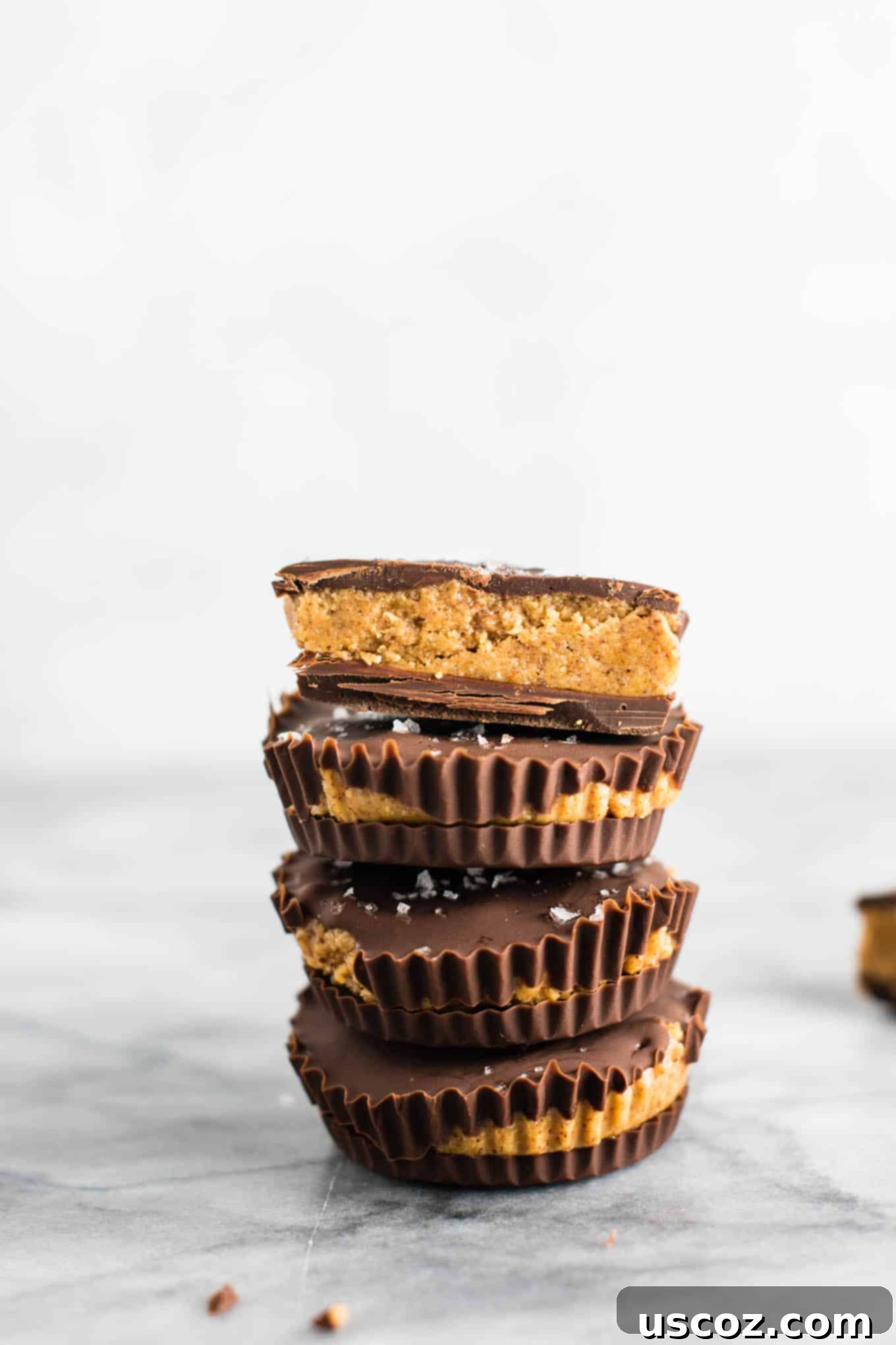 Close-up of freshly made chocolate almond butter cups with a creamy filling