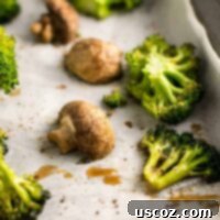 Garlic Herb Roasted Broccoli and Mushrooms 10 A round crop of the main roasted broccoli and mushroom dish, used as the recipe card's feature image