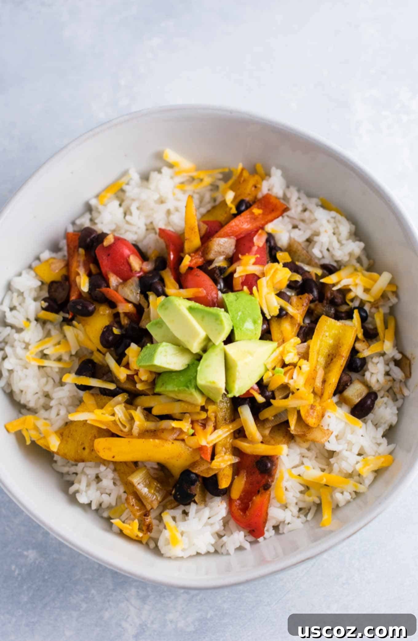 Plant-Powered Mexican Feasts 16 Vegetarian burrito bowl recipe with black beans, mini bell peppers, and fresh greens, beautifully arranged